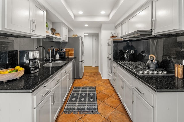 2648 State St Unit 32, Santa Barbara, CA 93105 - kitchen with a sink, stainless steel appliances, backsplash, recessed lighting, and open shelves