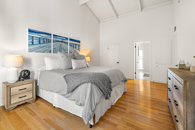 2648 State St Unit 32, Santa Barbara, CA 93105 - bedroom featuring high vaulted ceiling, light wood-type flooring, and beam ceiling