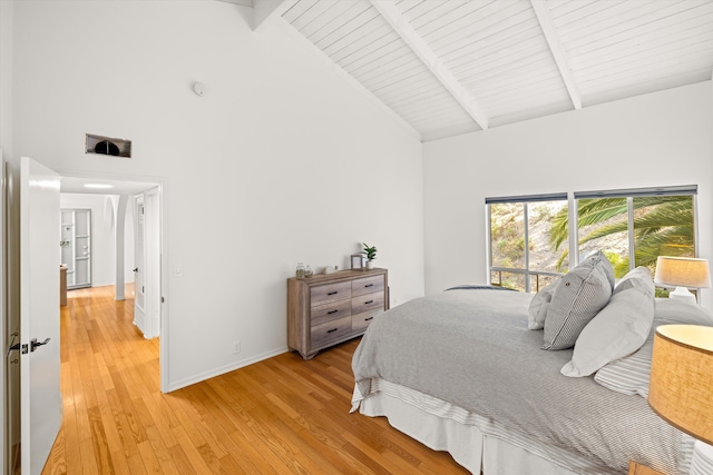 2648 State St Unit 32, Santa Barbara, CA 93105 - bedroom with high vaulted ceiling, light wood-type flooring, baseboards, and wood ceiling with exposed beams