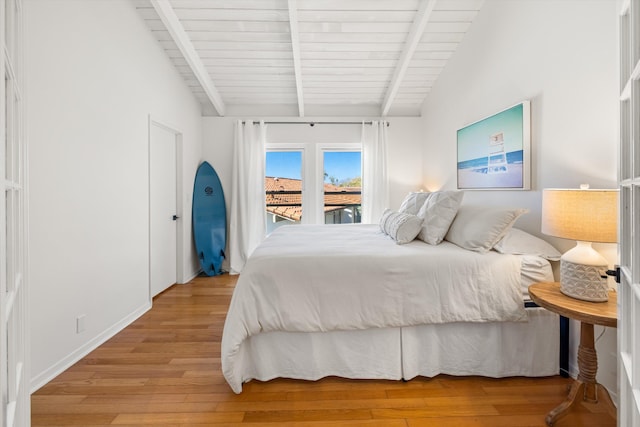 2648 State St Unit 32, Santa Barbara, CA 93105 - bedroom with light wood-type flooring, wooden ceiling, access to outside, and baseboards