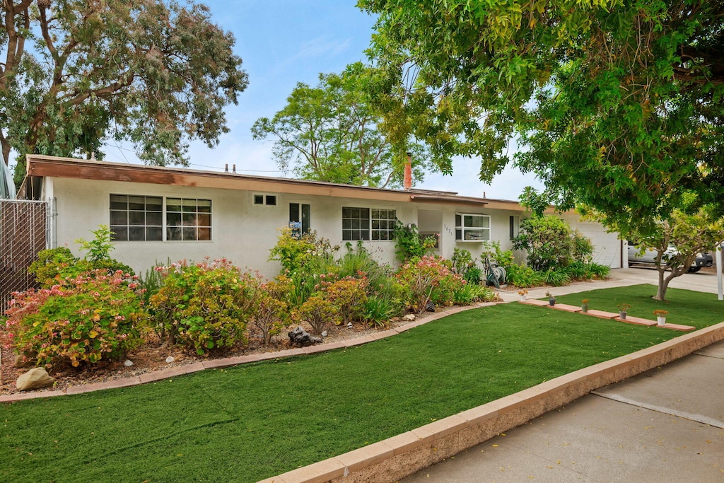 5671 Cathedral Oaks Rd, Goleta, CA 93117 - ranch-style house featuring stucco siding, a garage, and concrete driveway