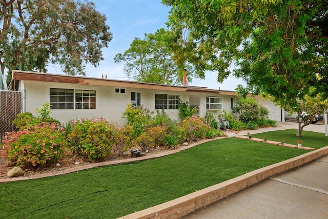 5671 Cathedral Oaks Rd, Goleta, CA 93117 - ranch-style house featuring stucco siding, an attached garage, and driveway