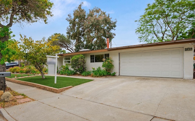 5671 Cathedral Oaks Rd, Goleta, CA 93117 - single story home featuring driveway, a garage, stucco siding, and a front yard