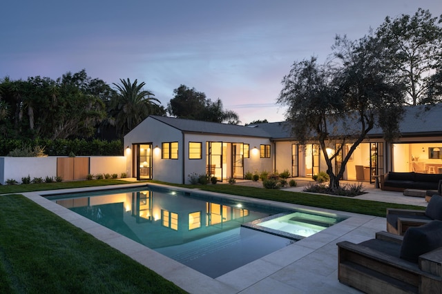 99 Sierra Vista Rd, Santa Barbara, CA 93108 - back of house featuring a patio area, a yard, outdoor lounge area, a pool with connected hot tub, and stucco siding