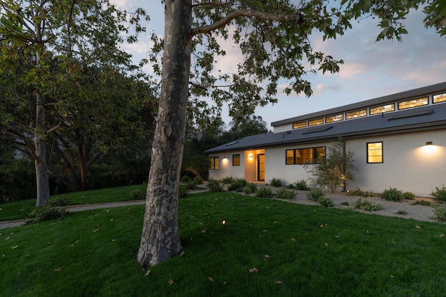 99 Sierra Vista Rd, Santa Barbara, CA 93108 - view of front facade with stucco siding and a lawn