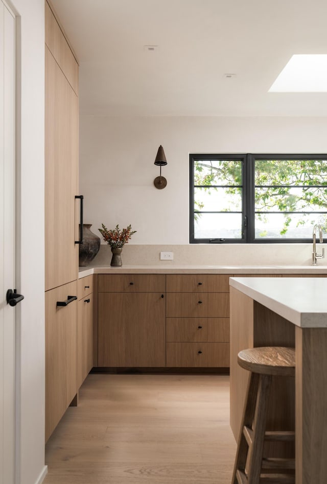 99 Sierra Vista Rd, Santa Barbara, CA 93108 - kitchen featuring light countertops, light wood-type flooring, light brown cabinetry, and healthy amount of natural light