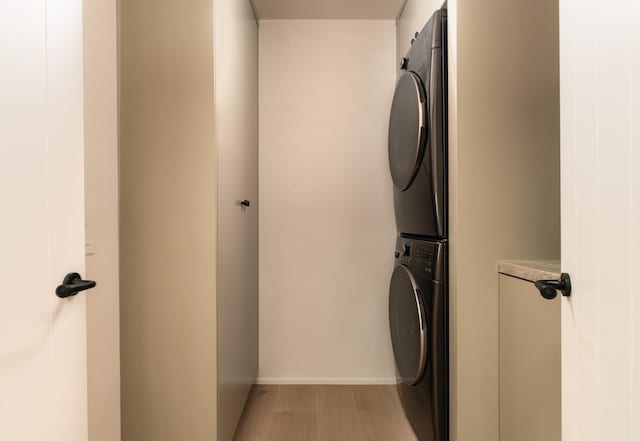 99 Sierra Vista Rd, Santa Barbara, CA 93108 - washroom with stacked washer and clothes dryer, baseboards, and light wood-style floors