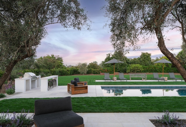 99 Sierra Vista Rd, Santa Barbara, CA 93108 - pool at dusk featuring a lawn, a patio area, and an outdoor pool