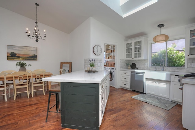 227 Menlo Dr, Buellton, CA 93427 - kitchen featuring dishwasher, washer / dryer, a sink, backsplash, and high vaulted ceiling
