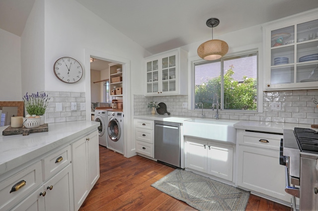 227 Menlo Dr, Buellton, CA 93427 - kitchen featuring washer and dryer, a sink, stainless steel appliances, tasteful backsplash, and vaulted ceiling