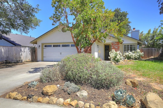 227 Menlo Dr, Buellton, CA 93427 - single story home with a chimney, an attached garage, concrete driveway, and stucco siding