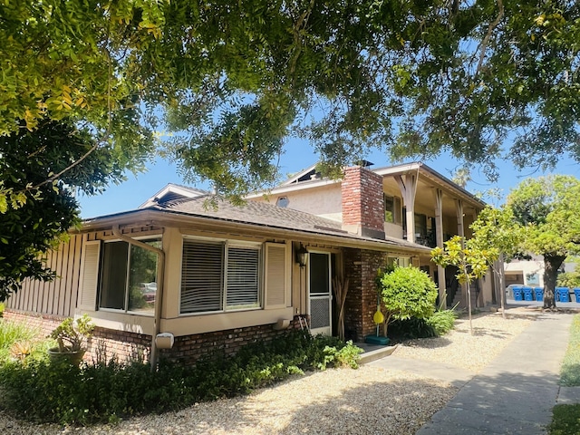 459 Linfield Pl, Goleta, CA 93117 - view of front of home featuring brick siding and a chimney