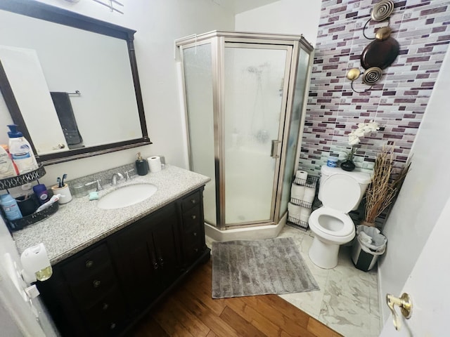 459 Linfield Pl, Goleta, CA 93117 - full bath featuring vanity, a shower stall, toilet, and wood finished floors