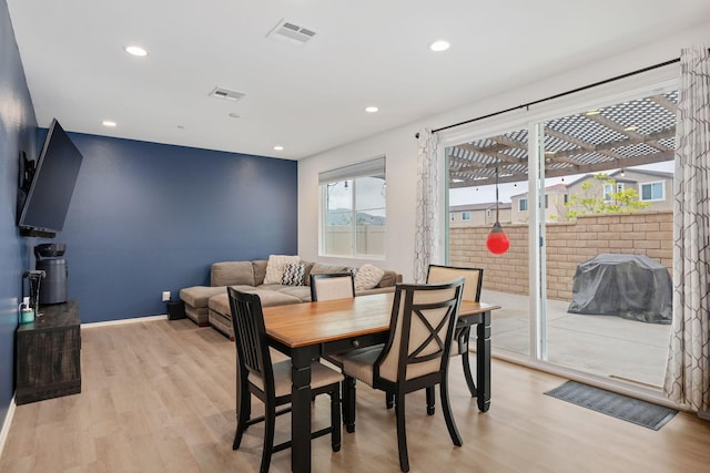1926 Pump House Ln, Santa Paula, CA 93060 - dining room with light wood-style flooring, recessed lighting, baseboards, and an accent wall