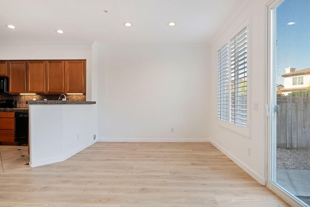 598 Poppyfield Pl, Goleta, CA 93117 - kitchen with black microwave, ornamental molding, brown cabinets, tasteful backsplash, and recessed lighting