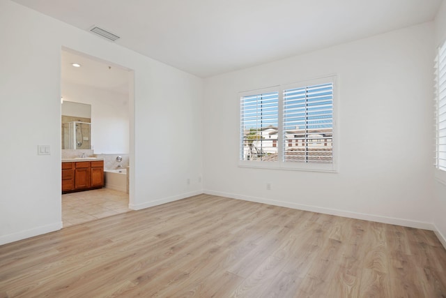 598 Poppyfield Pl, Goleta, CA 93117 - empty room featuring light wood-style floors, baseboards, and a sink