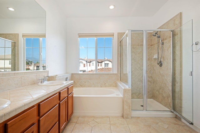 598 Poppyfield Pl, Goleta, CA 93117 - bathroom featuring a garden tub, a stall shower, double vanity, tile patterned flooring, and recessed lighting