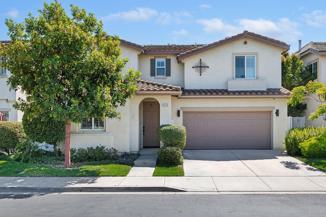 4538 Marrisa Way, Camarillo, CA 93012 - mediterranean / spanish-style home with a tile roof, an attached garage, concrete driveway, and stucco siding