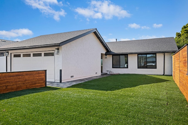 7352 Elmhurst Pl, Goleta, CA 93117 - rear view of house featuring roof with shingles, stucco siding, and a garage