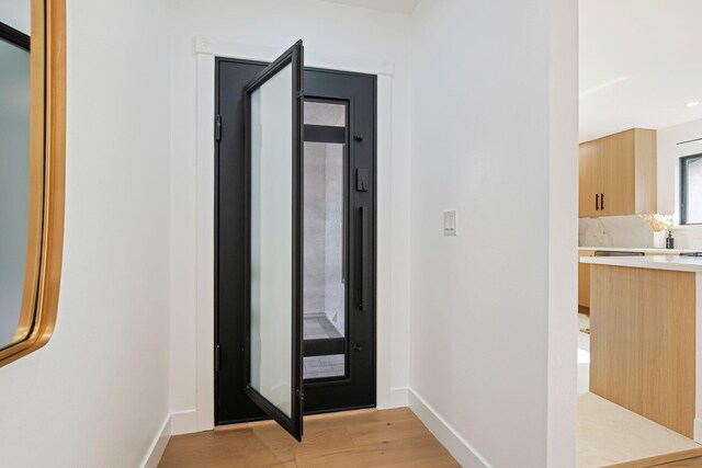 7352 Elmhurst Pl, Goleta, CA 93117 - entryway with light wood finished floors and baseboards