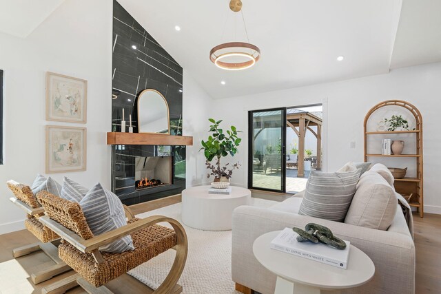 7352 Elmhurst Pl, Goleta, CA 93117 - living area featuring wood finished floors, recessed lighting, a fireplace, baseboards, and high vaulted ceiling