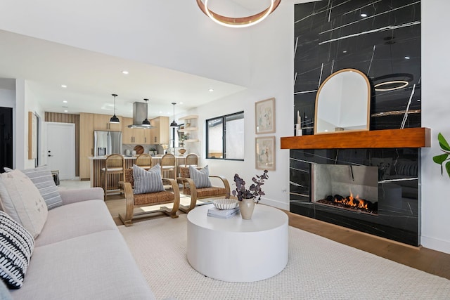 7352 Elmhurst Pl, Goleta, CA 93117 - living room with light wood-type flooring, recessed lighting, baseboards, and a multi sided fireplace