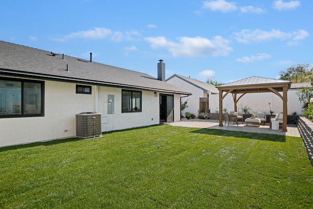 7352 Elmhurst Pl, Goleta, CA 93117 - rear view of property featuring central AC unit, a patio, stucco siding, outdoor lounge area, and a gazebo