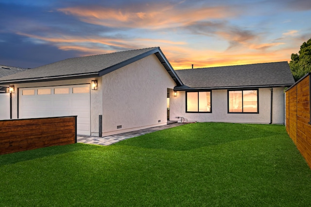 7352 Elmhurst Pl, Goleta, CA 93117 - back of property featuring a yard, a shingled roof, and stucco siding