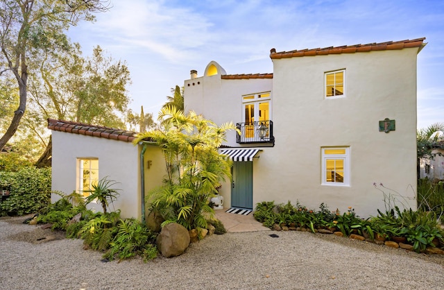 924 Garden St Unit F, Santa Barbara, CA 93101 - mediterranean / spanish house featuring a balcony, a tiled roof, and stucco siding