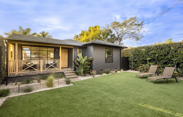 355 Palisades Dr, Santa Barbara, CA 93109 - view of front of home featuring a front lawn, covered porch, and stucco siding