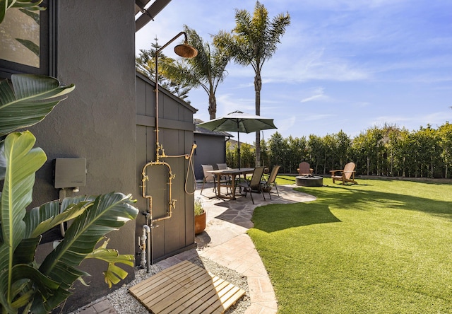 355 Palisades Dr, Santa Barbara, CA 93109 - view of grassy yard featuring a fire pit and a patio area
