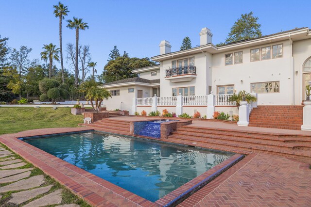 5287 N Creston Ln, Somis, CA 93066 - back of property featuring an outdoor pool, stucco siding, an outdoor hot tub, and a chimney