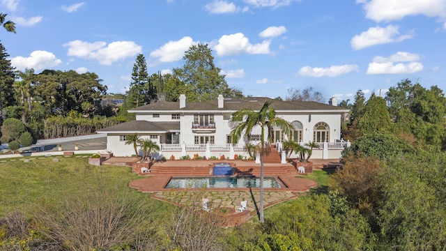 5287 N Creston Ln, Somis, CA 93066 - back of house with a chimney, an outdoor pool, stucco siding, a yard, and a balcony