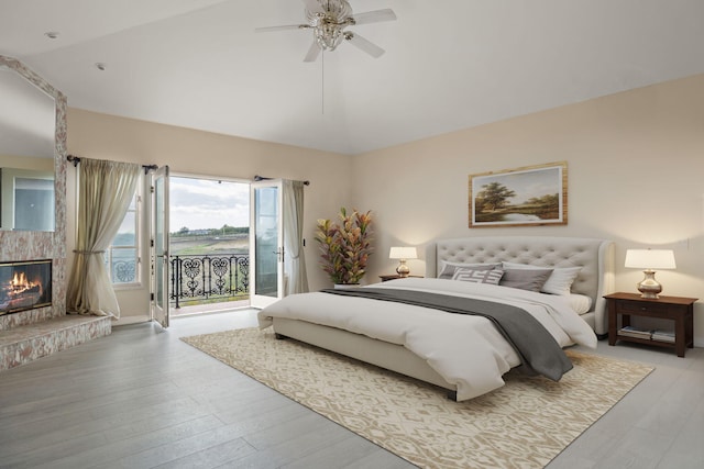 5287 N Creston Ln, Somis, CA 93066 - bedroom featuring access to outside, lofted ceiling, light wood finished floors, a glass covered fireplace, and a ceiling fan