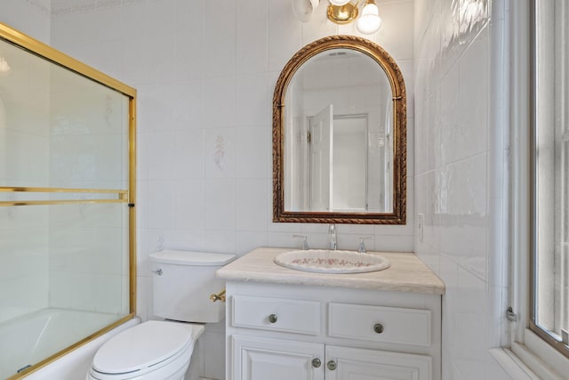 5287 N Creston Ln, Somis, CA 93066 - bathroom with tile walls, toilet, vanity, and combined bath / shower with glass door