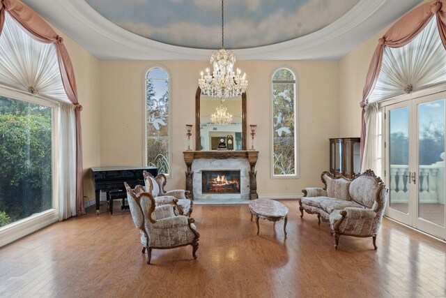 5287 N Creston Ln, Somis, CA 93066 - sitting room featuring a chandelier, hardwood / wood-style floors, a raised ceiling, french doors, and a premium fireplace