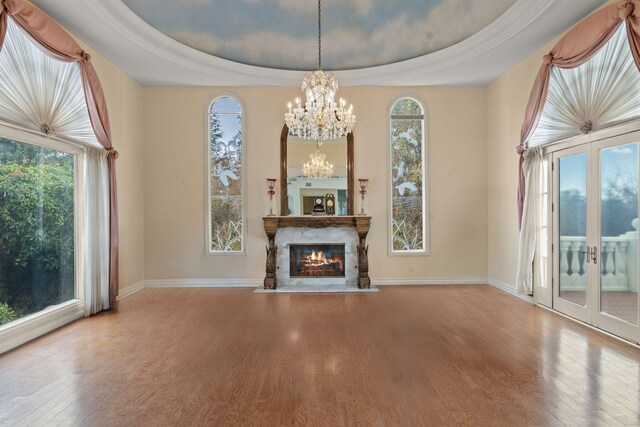 5287 N Creston Ln, Somis, CA 93066 - unfurnished living room with wood finished floors, a chandelier, french doors, a tray ceiling, and baseboards