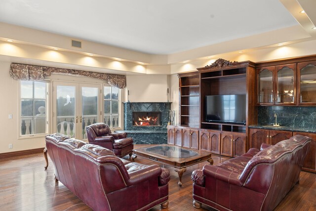 5287 N Creston Ln, Somis, CA 93066 - living area with wood finished floors, baseboards, a premium fireplace, and bar with sink