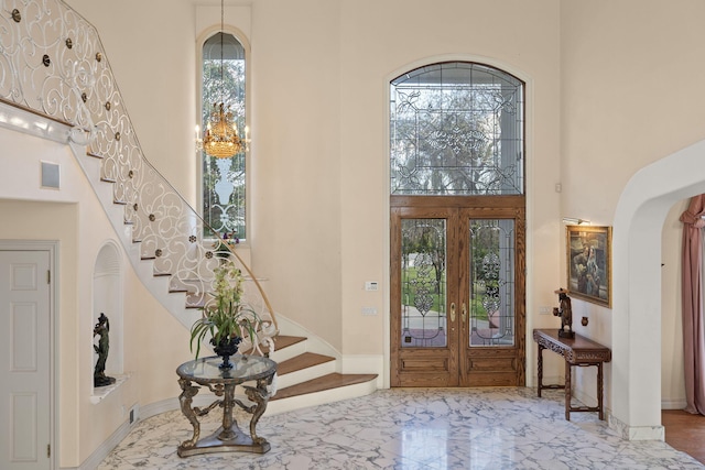 5287 N Creston Ln, Somis, CA 93066 - entrance foyer featuring a towering ceiling, stairs, marble tiled floors, arched walkways, and french doors