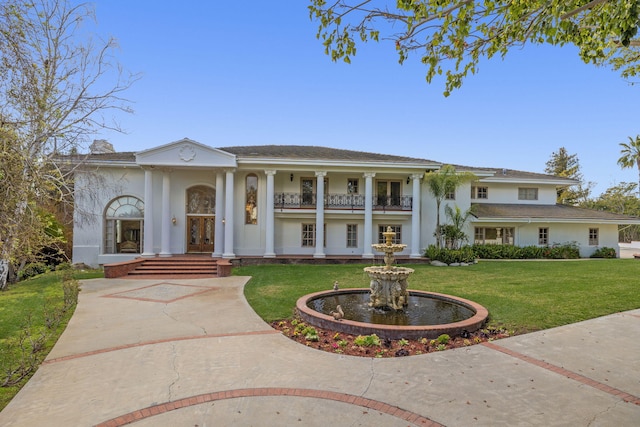 5287 N Creston Ln, Somis, CA 93066 - greek revival inspired property featuring french doors, stucco siding, a front lawn, curved driveway, and a balcony