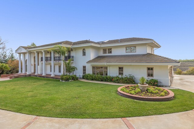 5287 N Creston Ln, Somis, CA 93066 - neoclassical / greek revival house with stucco siding, a front lawn, and covered porch