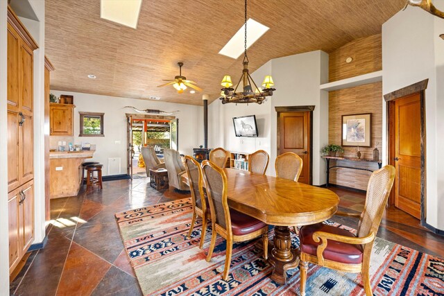 13750 Cuyama Hwy, Cuyama, CA 93461 - dining space with ceiling fan, a chandelier, baseboards, wood ceiling, and high vaulted ceiling