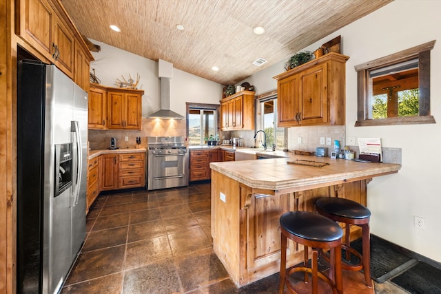 13750 Cuyama Hwy, Cuyama, CA 93461 - kitchen featuring appliances with stainless steel finishes, a peninsula, plenty of natural light, brown cabinets, and recessed lighting