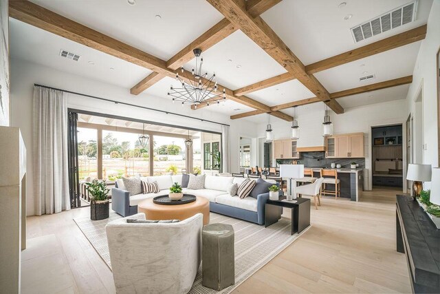 123 Polo Way, Santa Barbara, CA 93013 - living area featuring coffered ceiling, beam ceiling, a chandelier, and light wood-style flooring