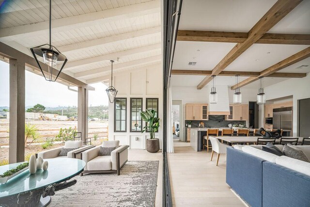123 Polo Way, Santa Barbara, CA 93013 - living area with beamed ceiling and light wood-style flooring