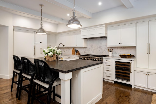 1479 Bonnymede Dr, Santa Barbara, CA 93108 - kitchen with wine cooler, beamed ceiling, dark wood finished floors, backsplash, and white cabinetry