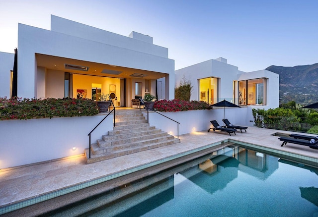356 Woodley Rd, Montecito, CA 93108 - rear view of property with stairs, an outdoor pool, stucco siding, and a patio