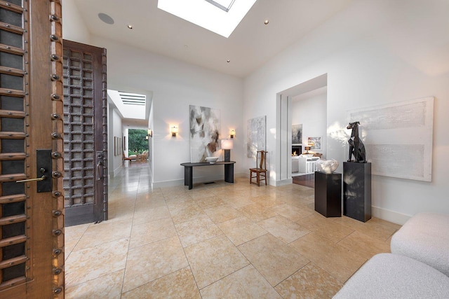 356 Woodley Rd, Montecito, CA 93108 - corridor with a skylight, high vaulted ceiling, and baseboards