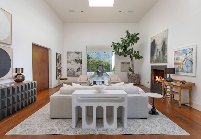 356 Woodley Rd, Montecito, CA 93108 - living room featuring a high end fireplace, wood finished floors, baseboards, and a high ceiling