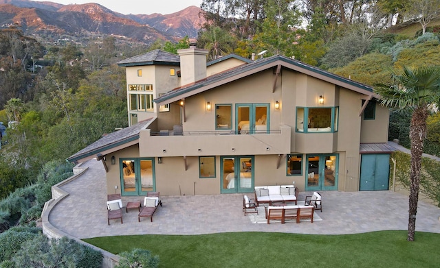 62 Canon View Rd, Montecito, CA 93108 - rear view of house featuring french doors, an outdoor living space, a chimney, a balcony, and stucco siding